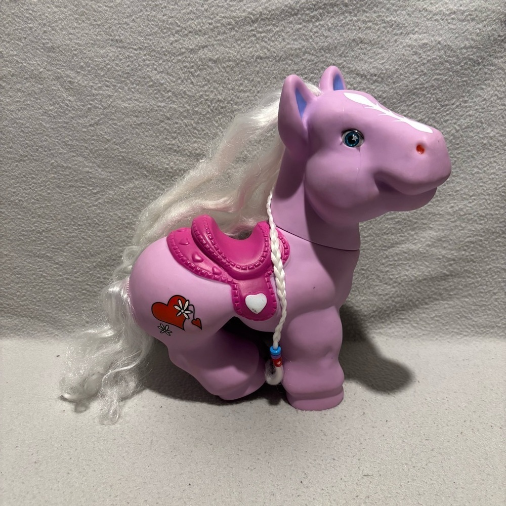 Pony 11” lavender with pink saddle silver hair and a braid red heart